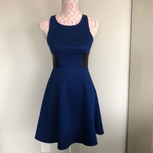 Blue cocktail dress with leather detail
